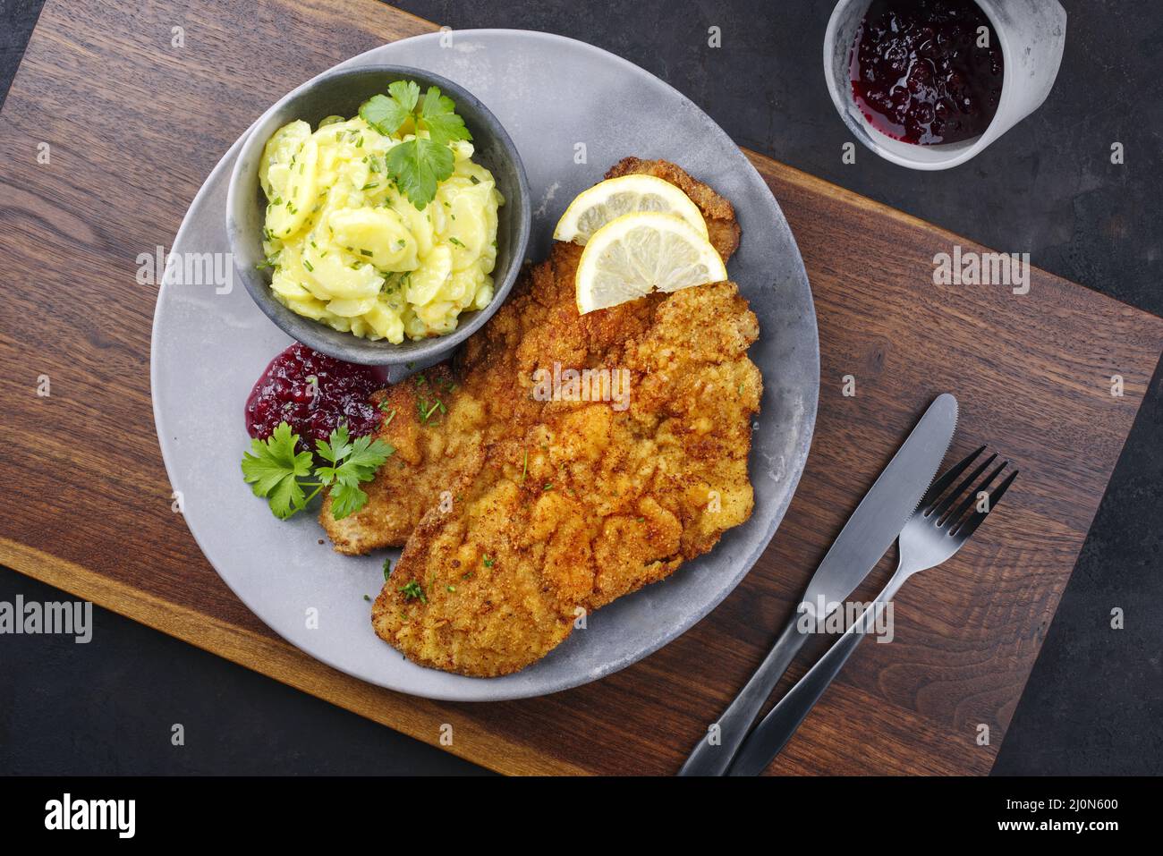 Traditional deepfried schnitzel with potato salad Stock Photo Alamy