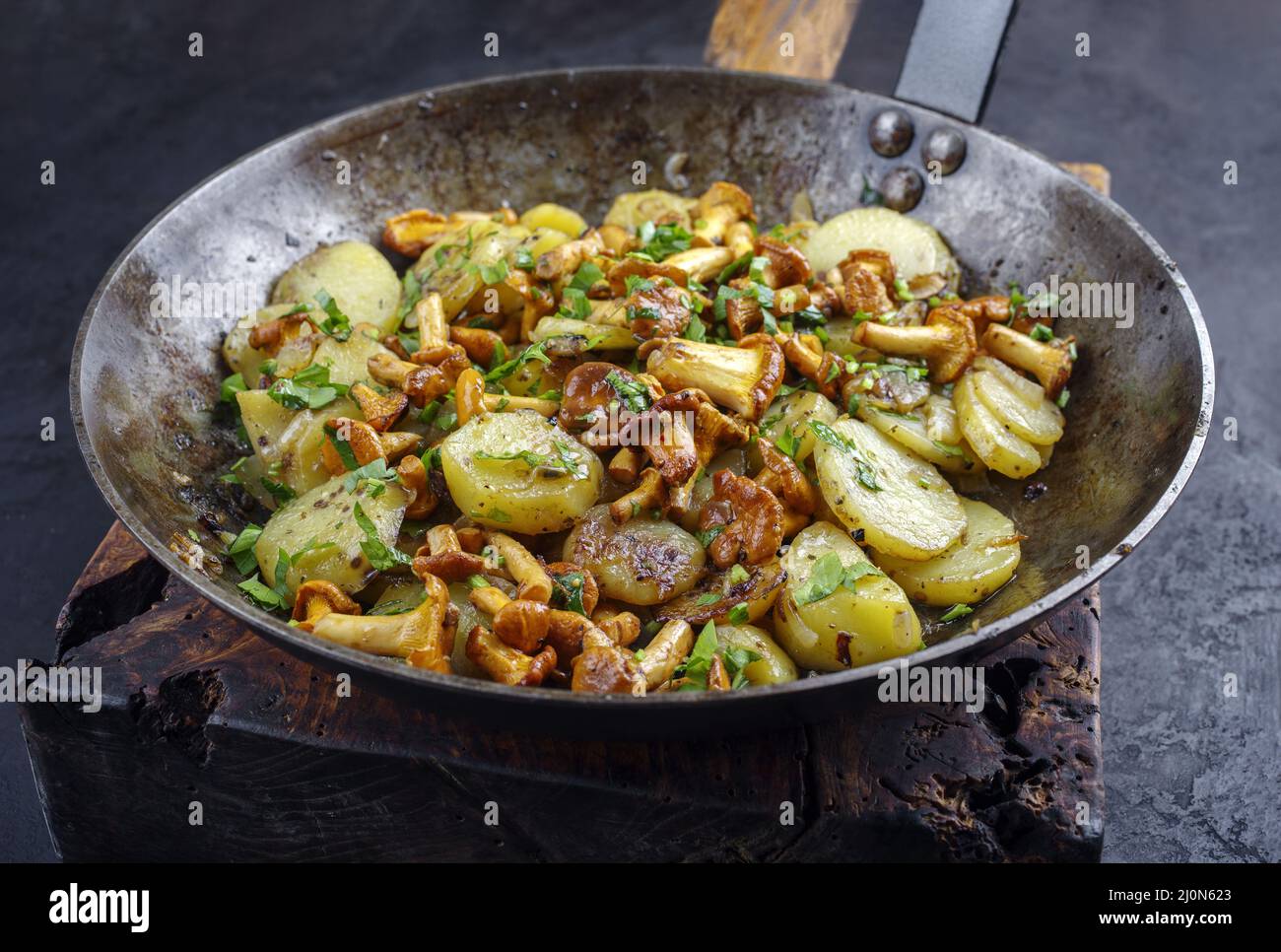 Traditional fresh chanterelles with fried potatoes and parsley served