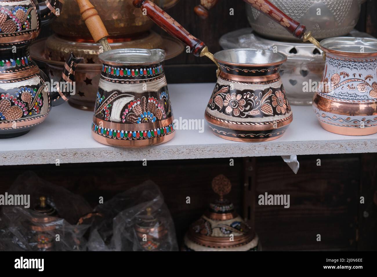 https://c8.alamy.com/comp/2J0N6EE/ancient-style-coffee-pot-antique-copper-made-traditional-turkish-coffee-maker-2J0N6EE.jpg