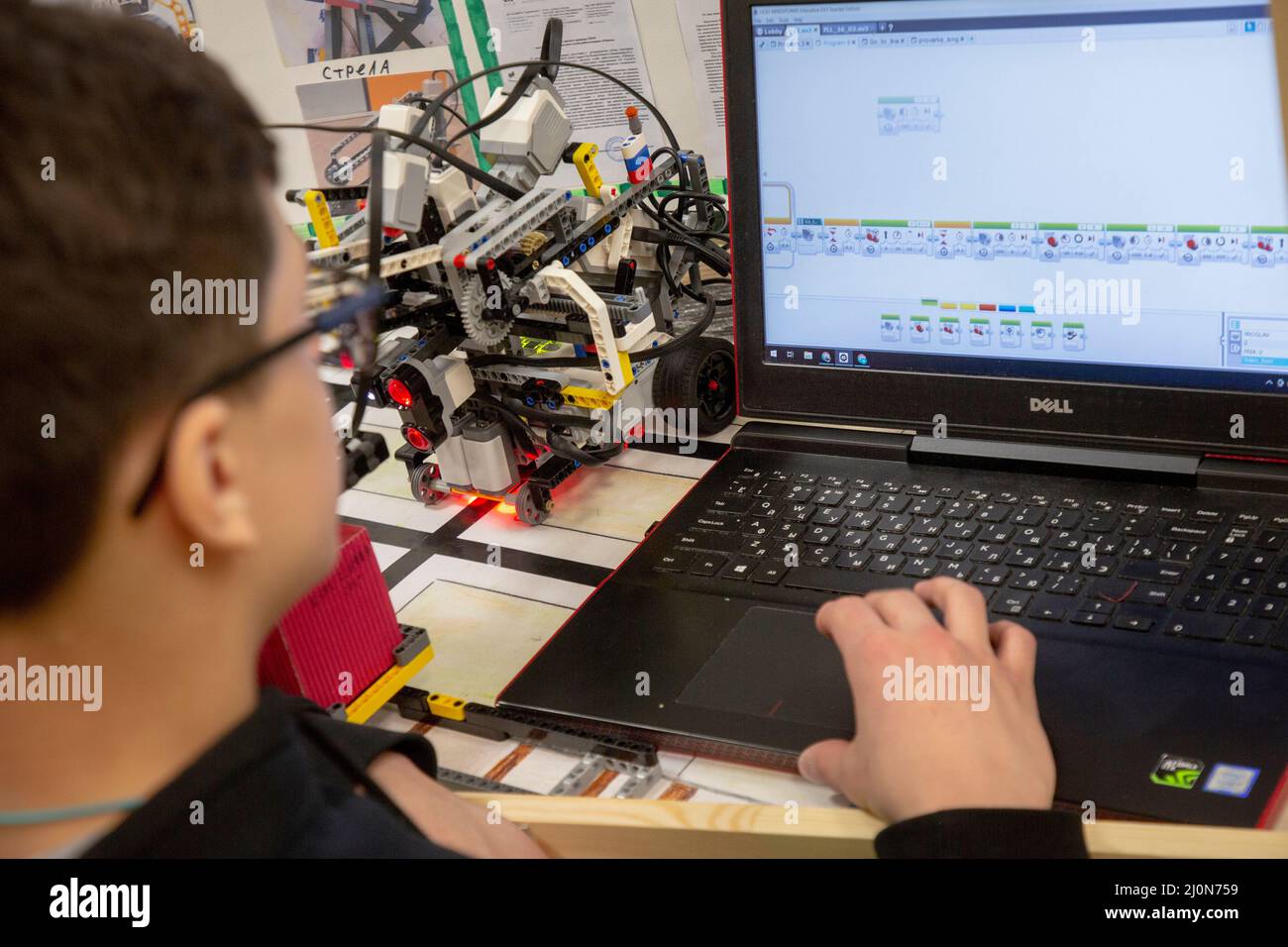 Moscow, Russia. 18th of March, 2022 Participiant is programming a robot during competion at the National Robotics Championship "First Robotics Championship - Moscow 3.0" at the Central Exhibition Complex "Expocentre" in Moscow, Russia Stock Photo