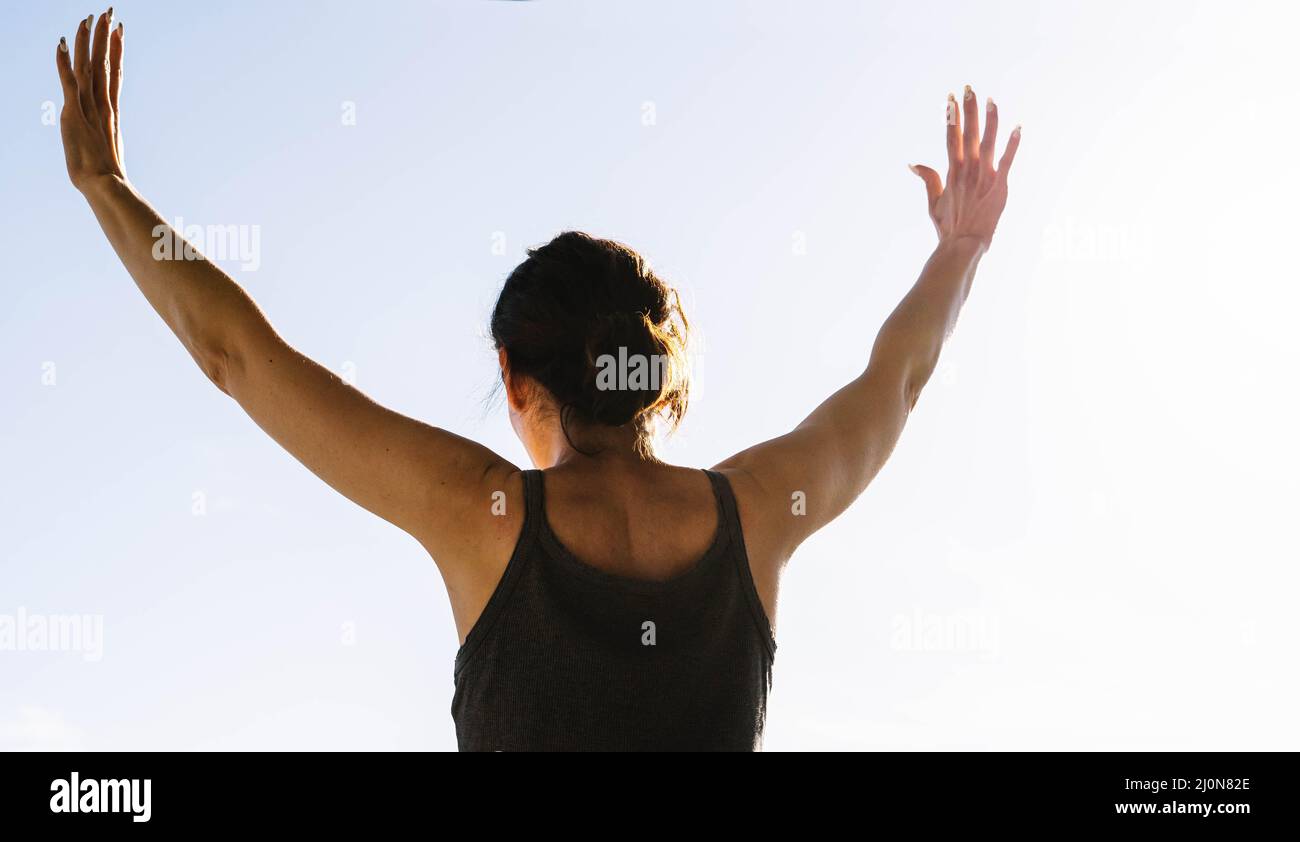 woman raising her arms Stock Photo - Alamy