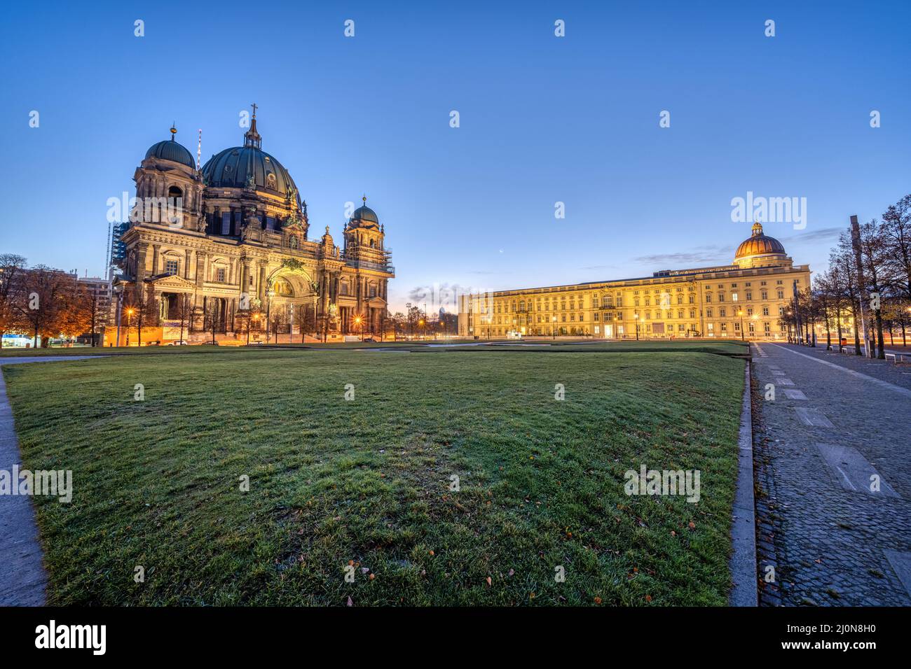 The Lustgarten in Berlin before sunrise with the cathedral and the City Palace Stock Photo