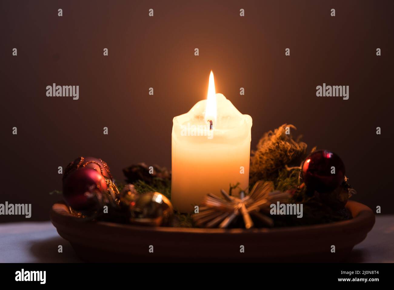 Burning candle of romantic atmosphere - Christmas tree balls Stock Photo
