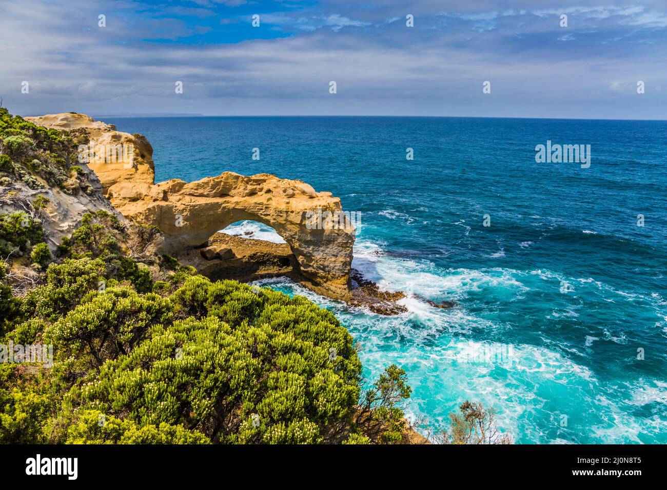 Coastal rocks formed a picturesque arch Stock Photo
