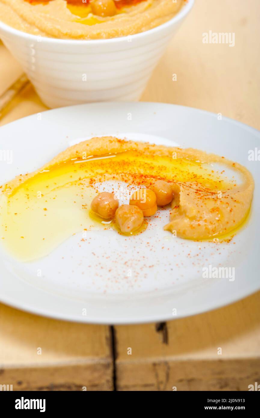 traditional chickpeas Hummus with pita bread and paprika on top Stock