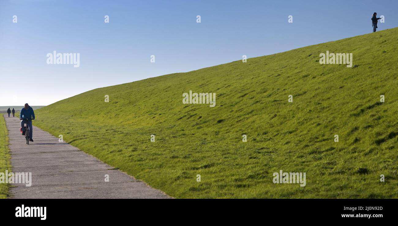 Dike landscape with a lot of space and few people, Pilsum, East Frisia, Germany, Europe Stock Photo