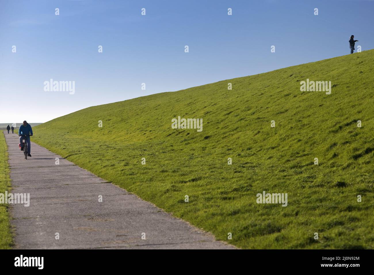 Dike landscape with a lot of space and few people, Pilsum, East Frisia, Germany, Europe Stock Photo