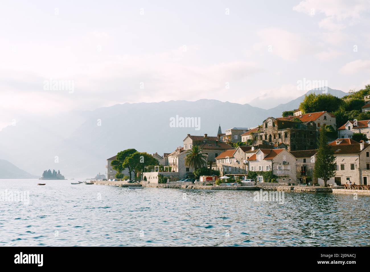 Perast coast with old buildings with red roofs. Montenegro Stock Photo