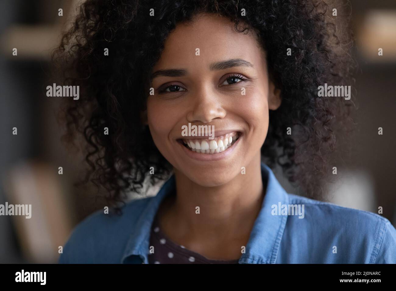 Happy joyful girl looking at camera with toothy smile Stock Photo - Alamy