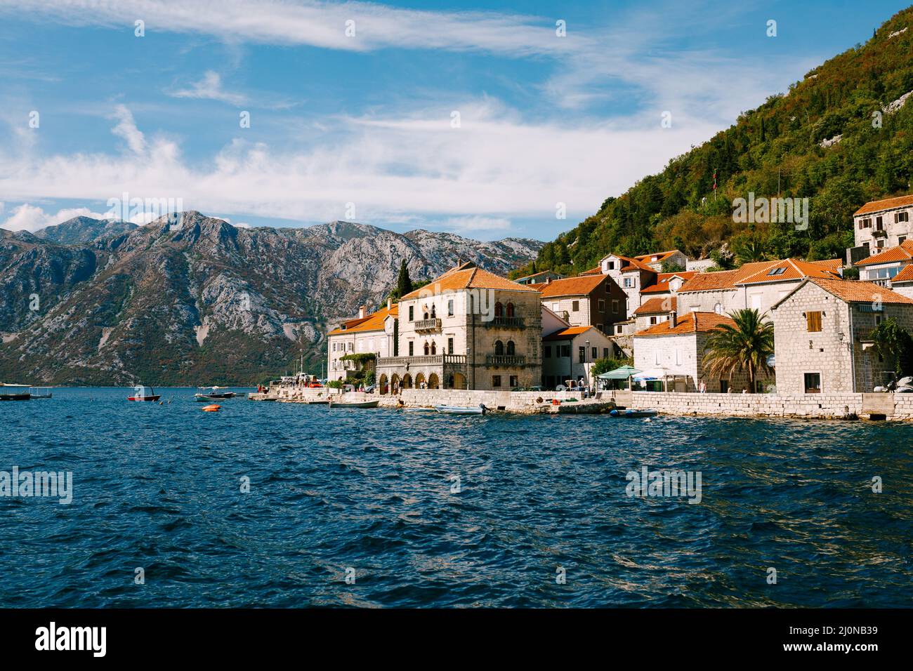 Houses with red tiled roofs on the banks of Perast. Montenegro Stock Photo