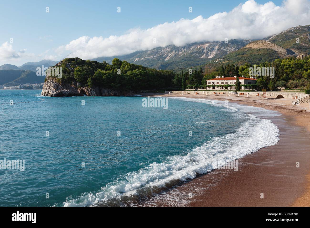 Azure surf on the royal beach near Villa Milocer. Montenegro Stock Photo