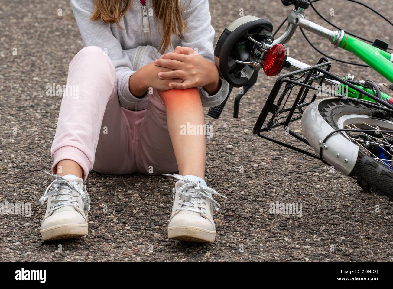 Girl in pain after a bicycle accident Stock Photo