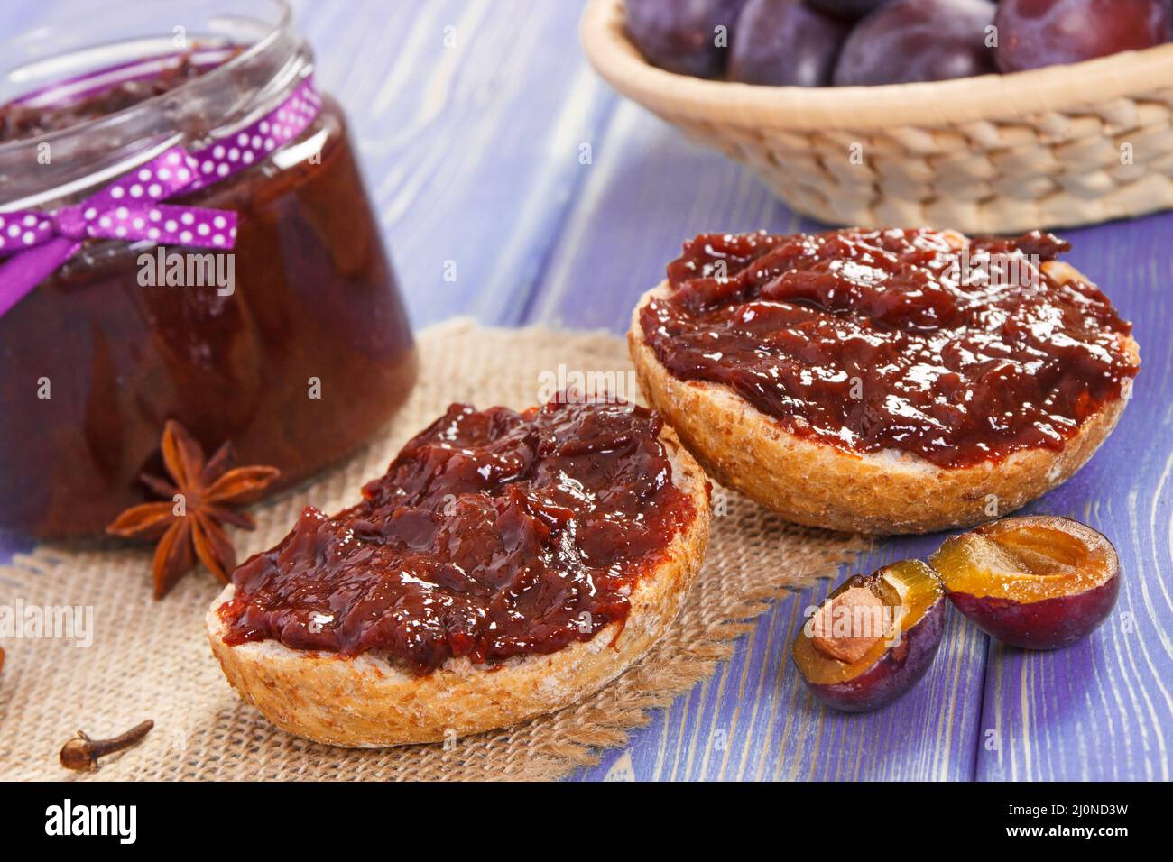 Fresh prepared sandwiches with plum marmalade or jam, concept of healthy sweet snack, breakfast or dessert Stock Photo