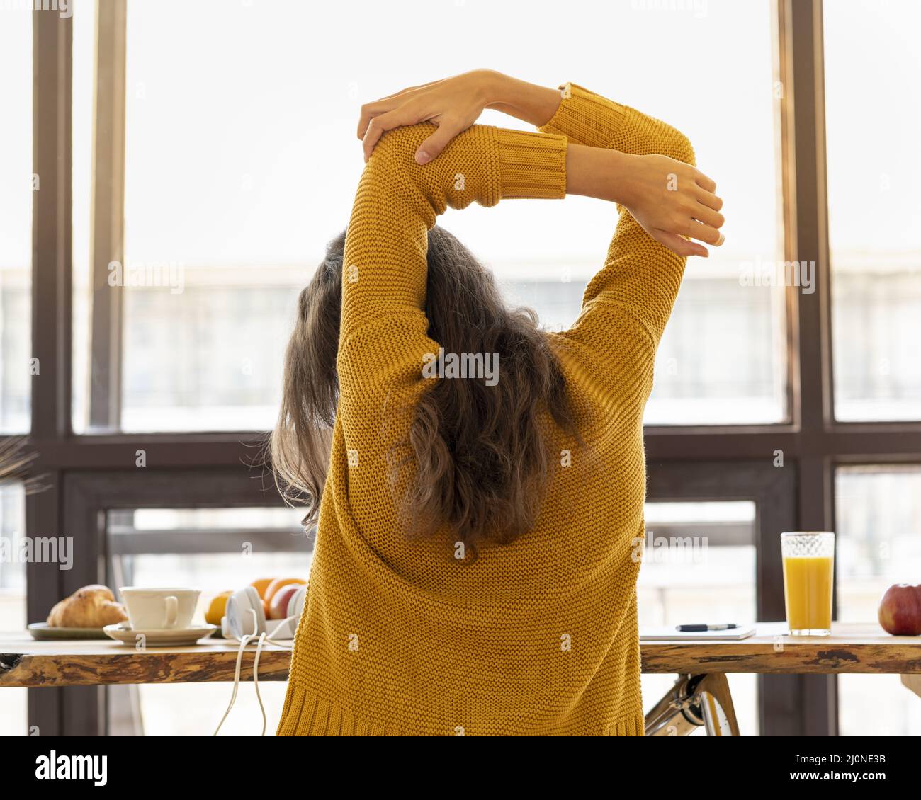 Back view of faceless young woman with stiff muscles, tense and joints ache Stock Photo