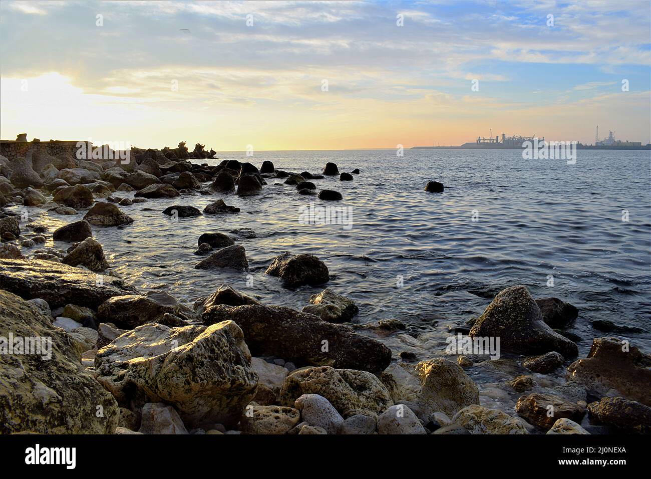 Rocky Shore at Sunrise Stock Photo - Alamy