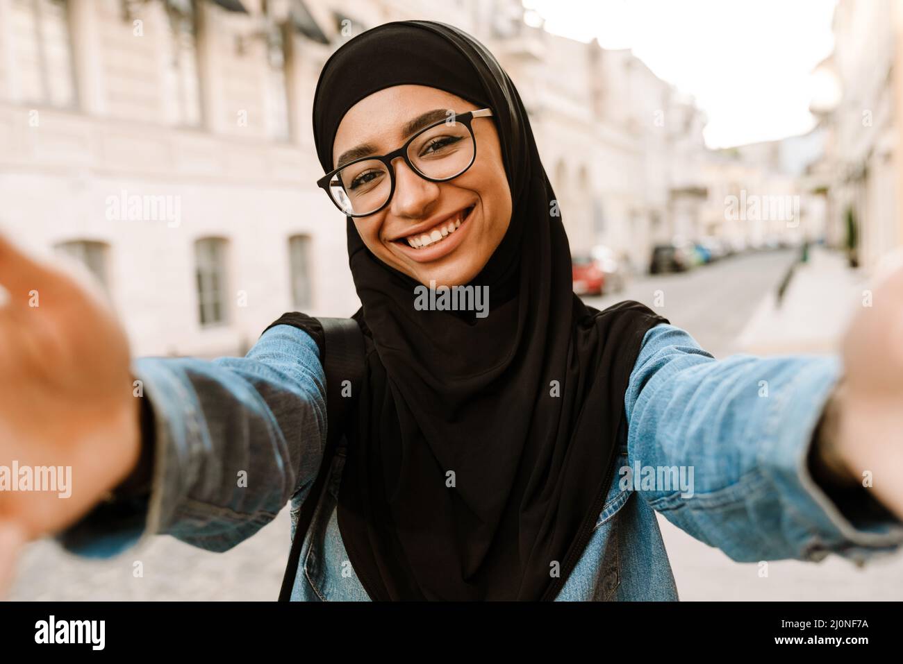 Premium Vector  Young muslim woman wearing hijab taking selfie