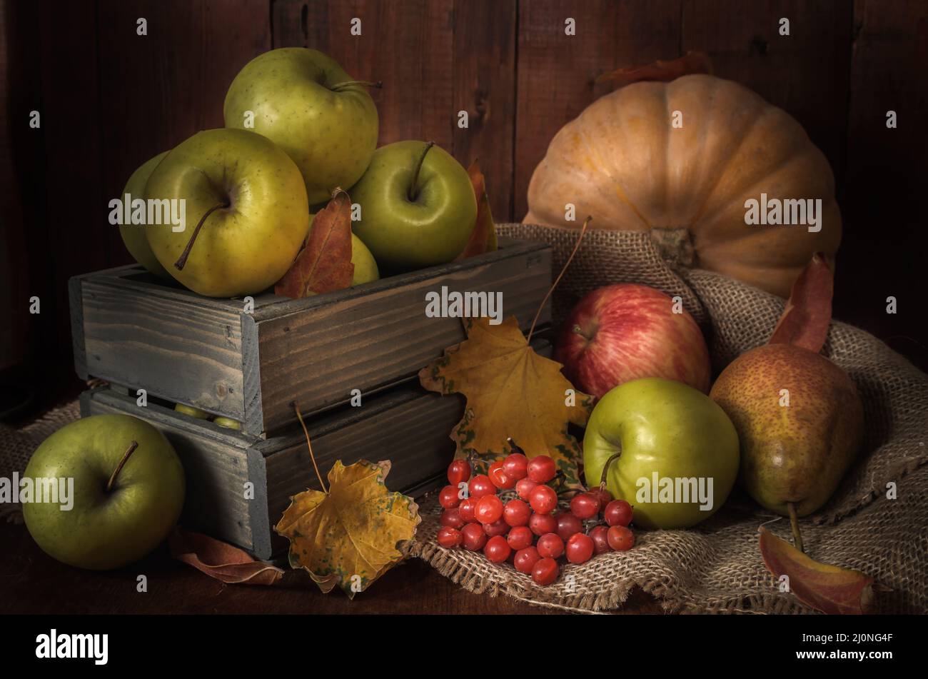 Apples and other foods on a dark wooden background in a rustic style Stock Photo