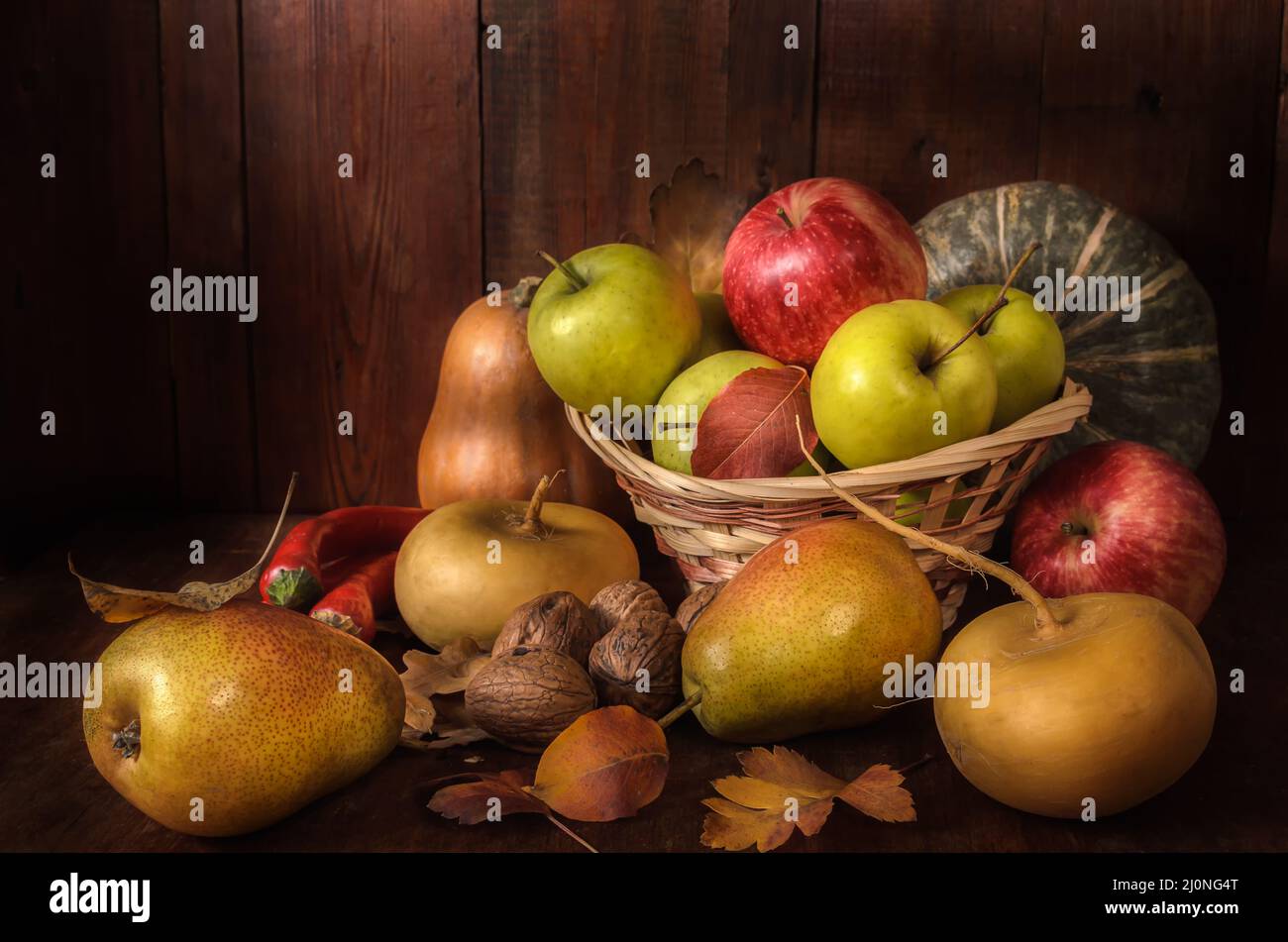 Fruits and vegetables on a dark wooden background in a rustic style Stock Photo