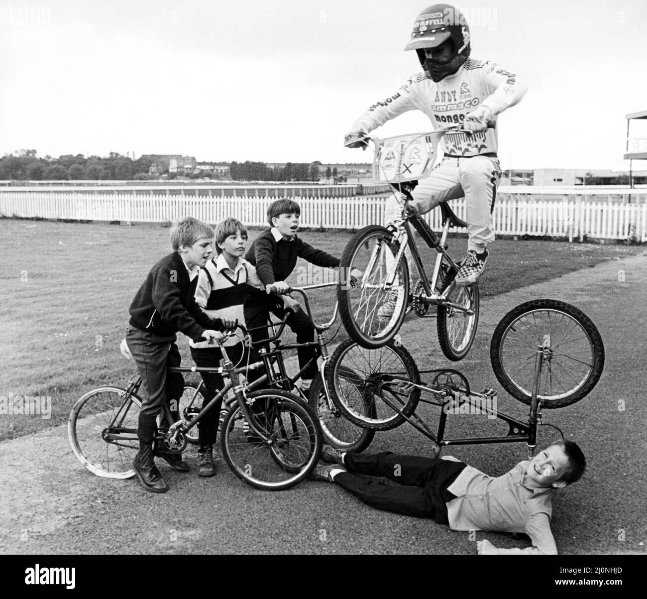 Children practising stunts at Stockton's redundant racecourse. The company running the complex is planning an international standard BMX track, snooker club, golf driving range, funfair, dormitory style accommodation block, an exhibition site and a sunday market. 20th June 1984. Stock Photo