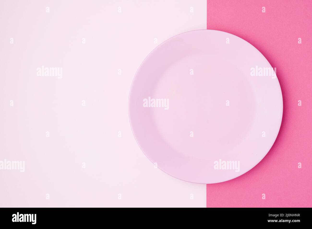 Top view pink plate table. High quality and resolution beautiful photo concept Stock Photo