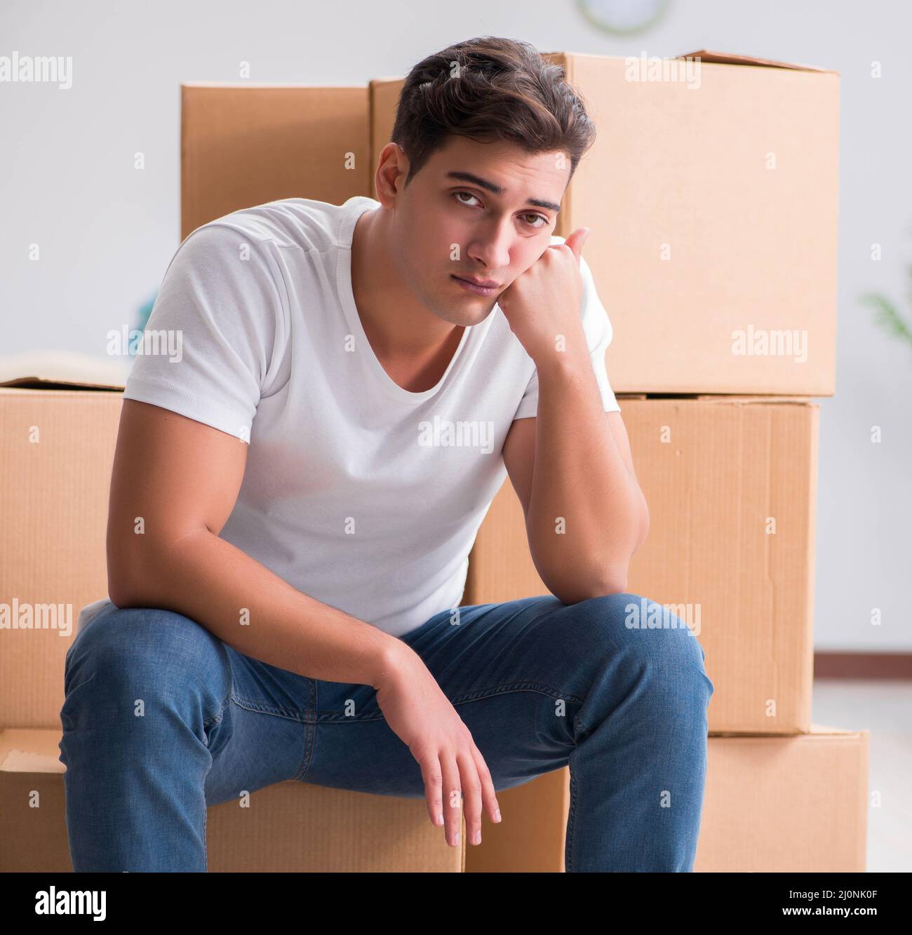 Man caryying boxes at home Stock Photo