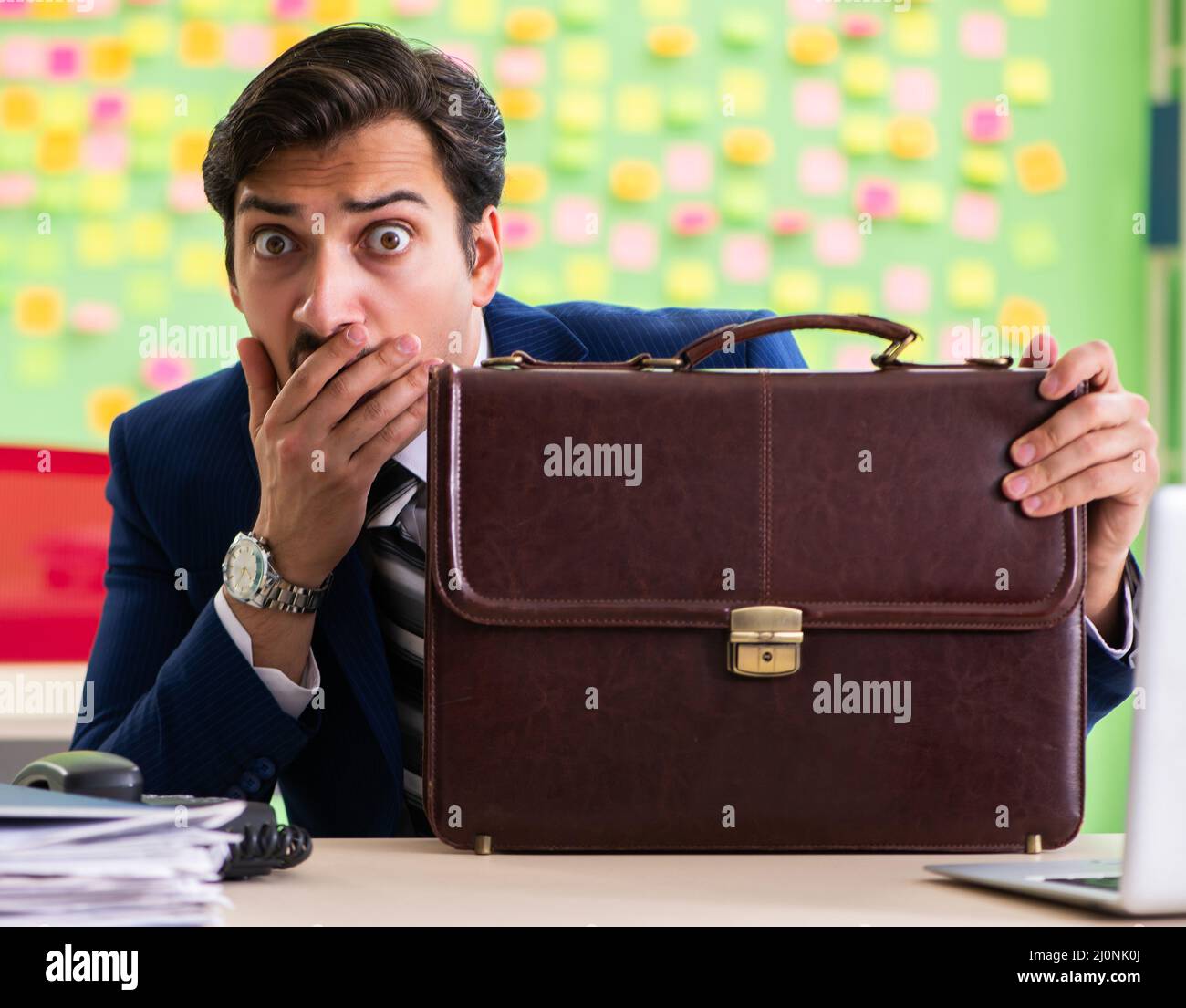 Businessman with many conflicting priorities Stock Photo