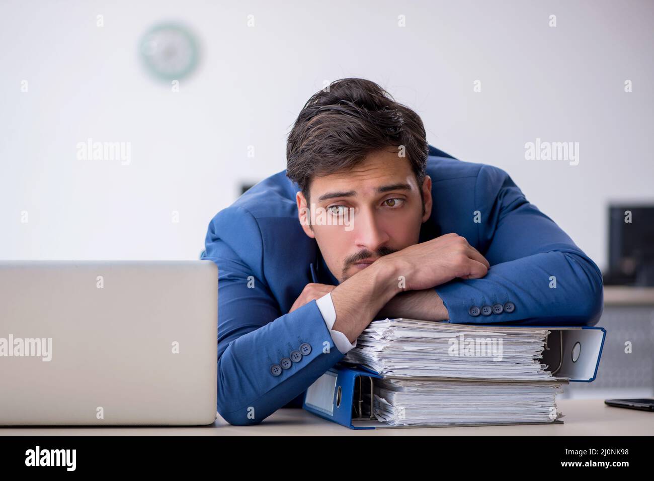 Young male employee working in the office Stock Photo