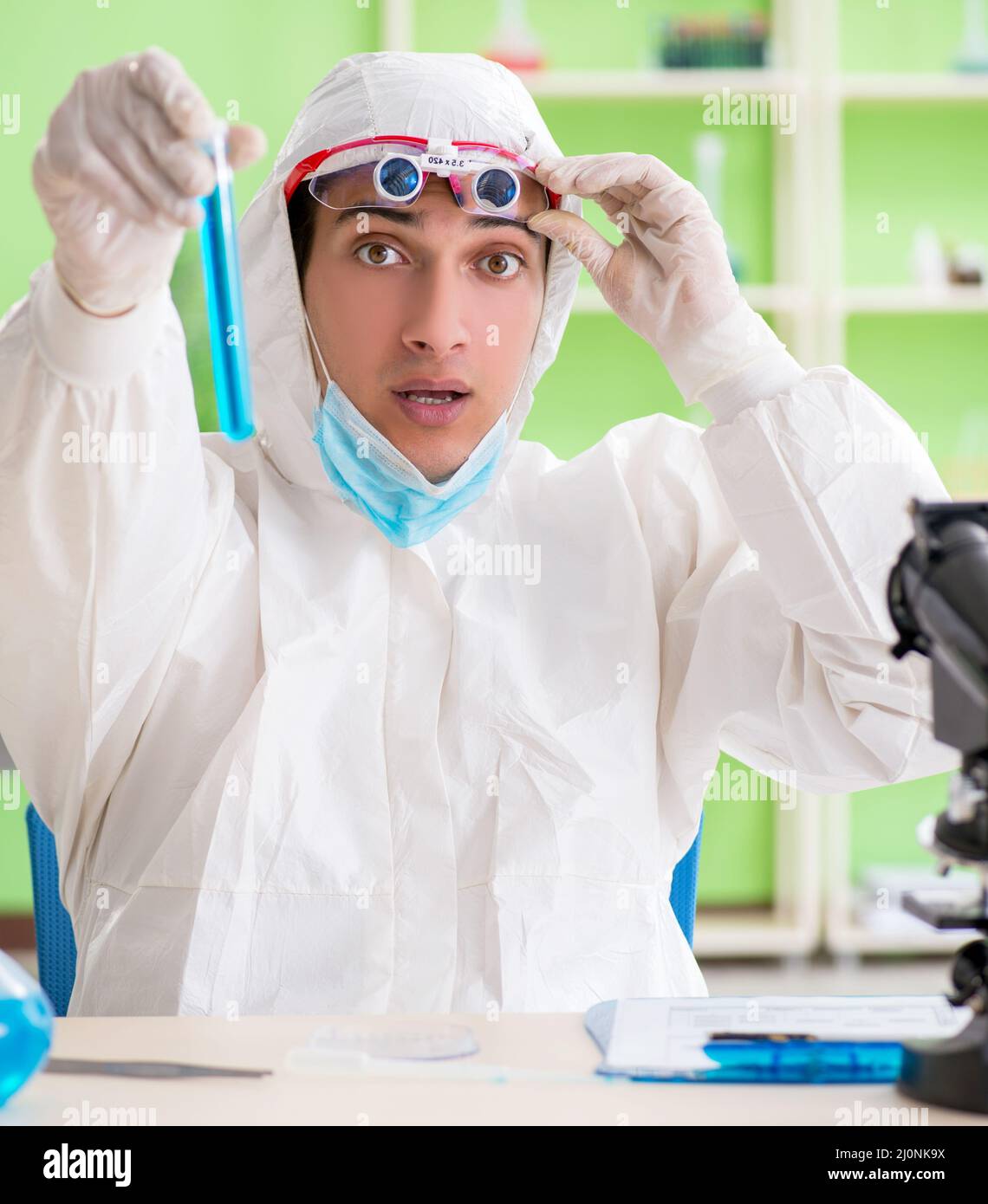 Chemist working in the lab on new experiment Stock Photo