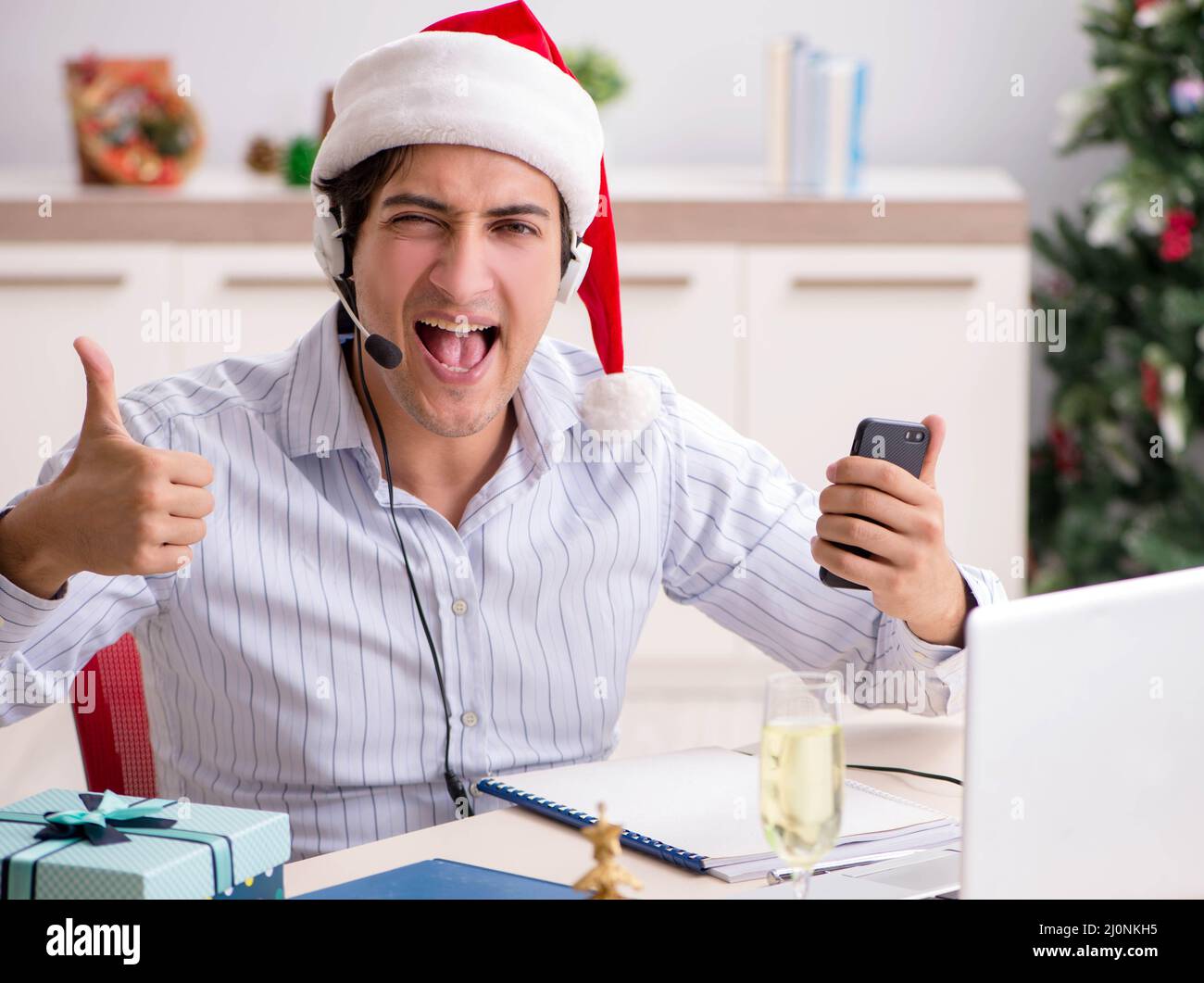 Telesales operator during christmas sale on the phone Stock Photo