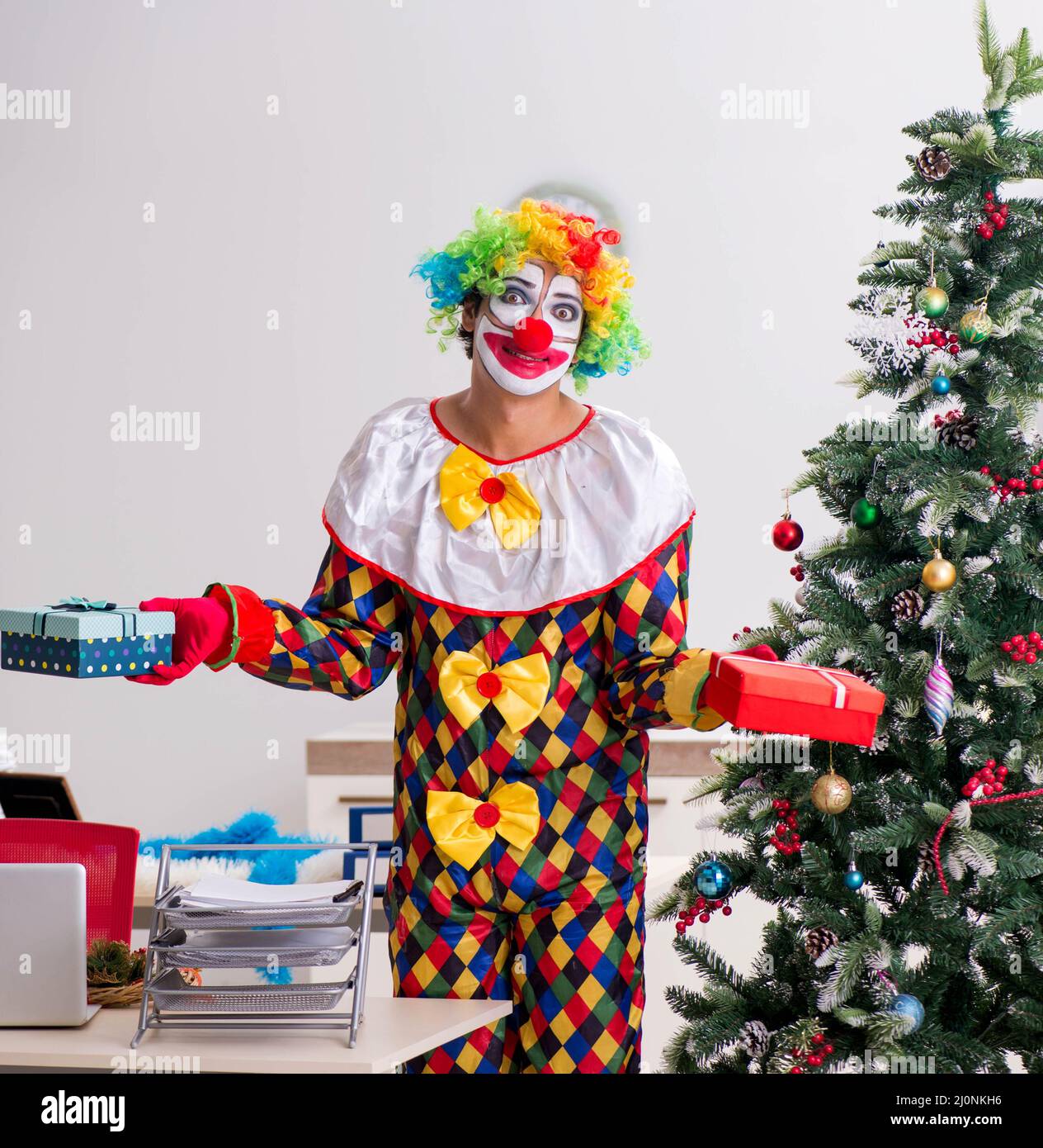 Funny clown in Christmas celebration concept Stock Photo