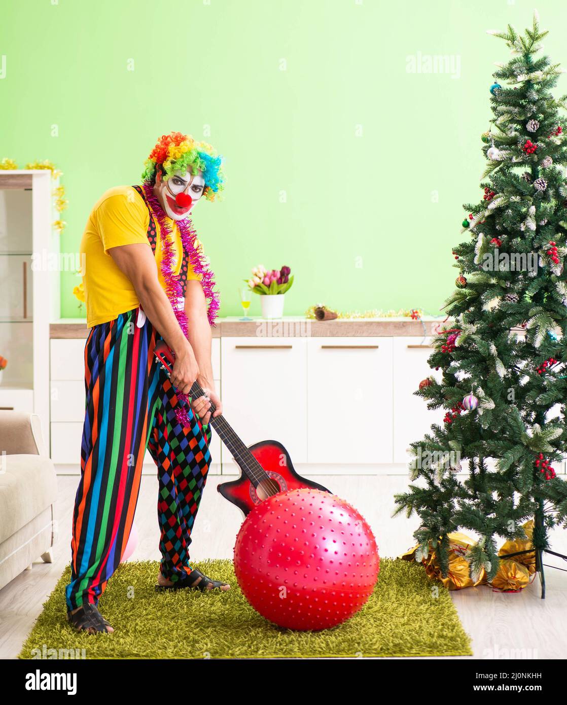 Funny clown in Christmas celebration concept Stock Photo