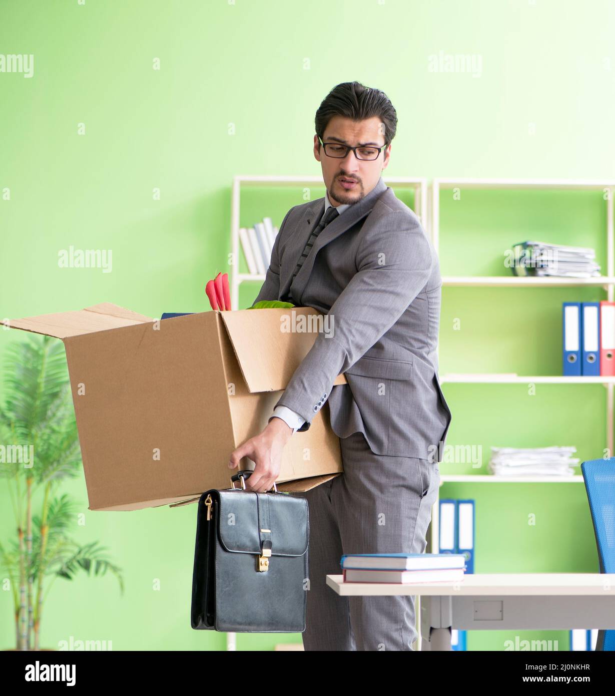 Male employee collecting his stuff after redundancy Stock Photo