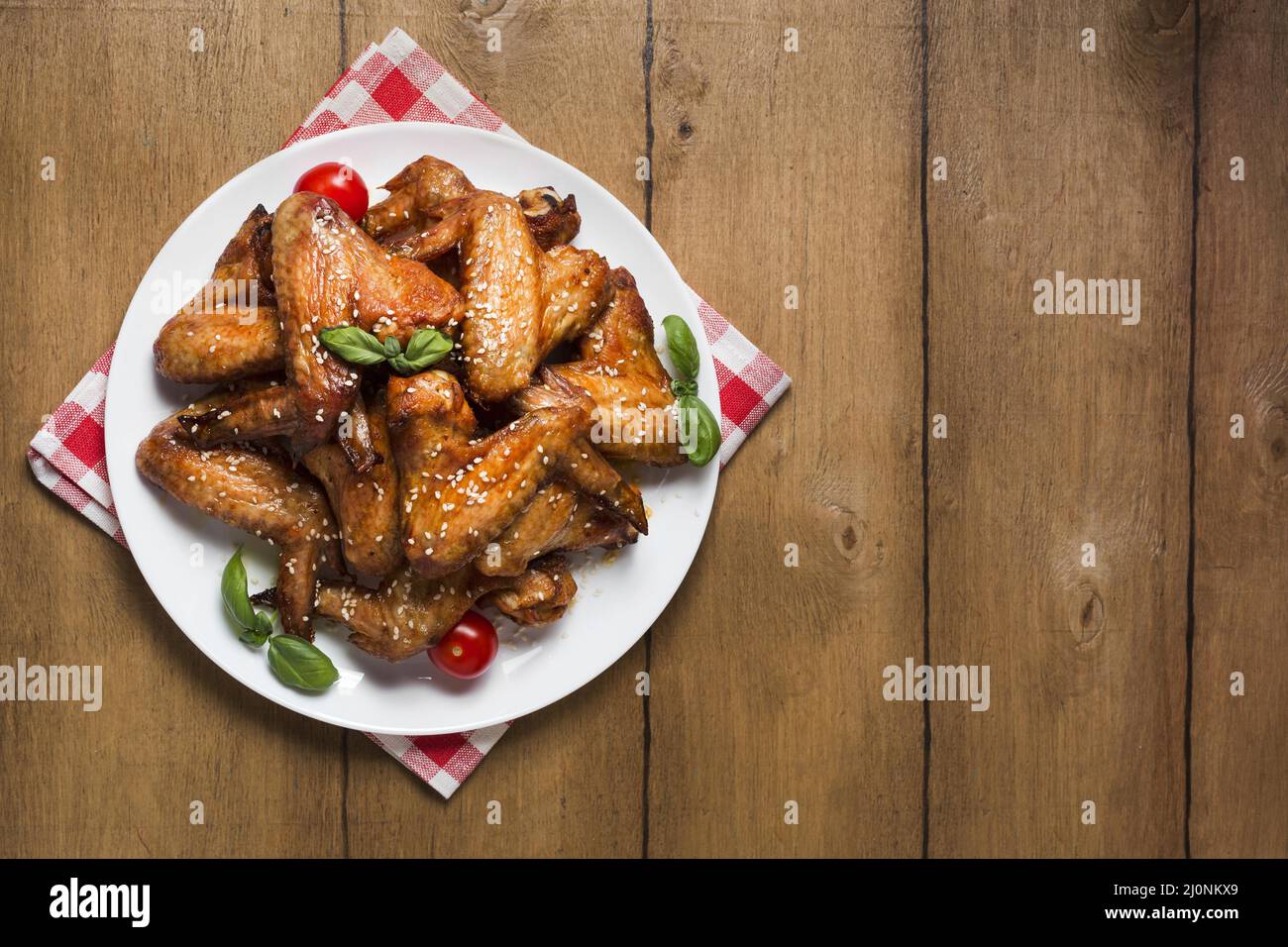 Top view chicken wings plate with sesame seeds copy space. High quality and resolution beautiful photo concept Stock Photo