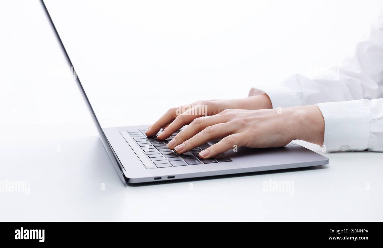 Female hands typing on laptop Stock Photo