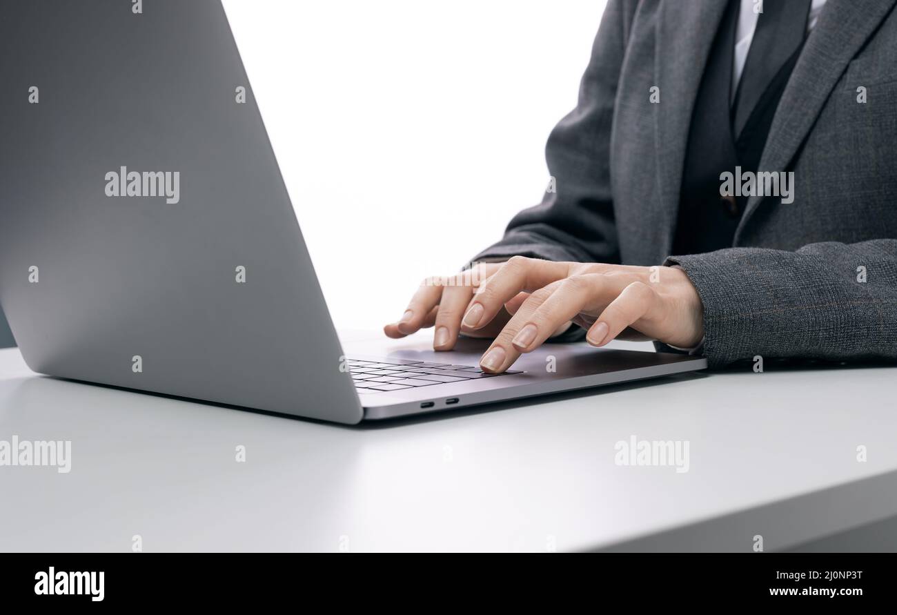 Female hands typing on laptop Stock Photo