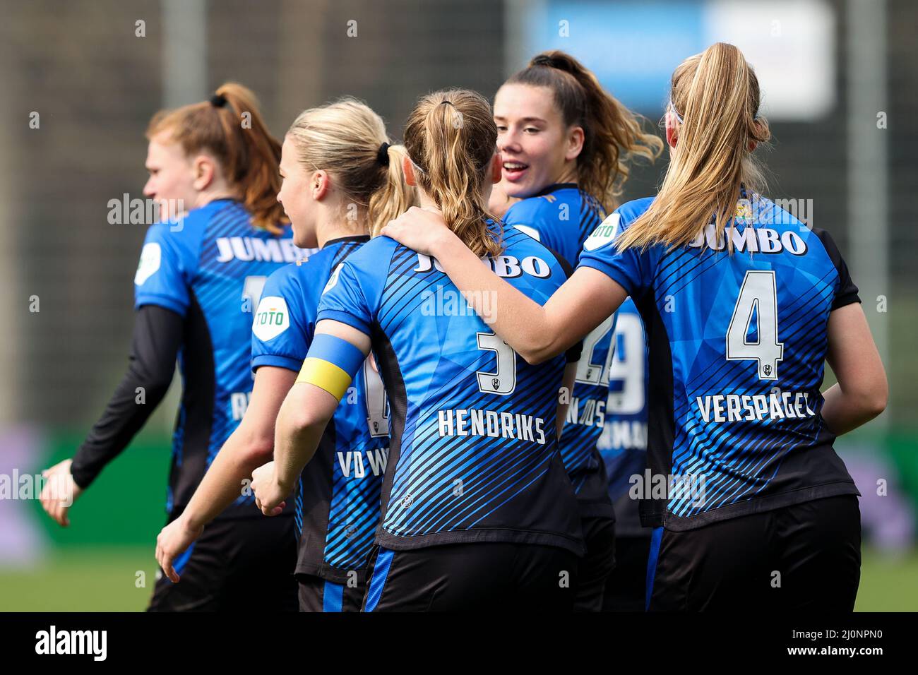 EINDHOVEN, THE NETHERLANDS - MARCH 20: Gwyneth Hendriks of ADO Den Haag  celebrates after scoring the first goal of the team, Amber Verspaget of ADO  Den Haag, Louise van Oosten of ADO
