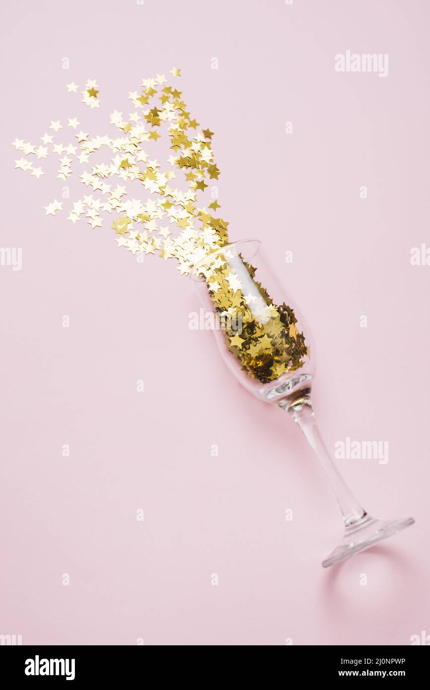 Star spangles scattered from glass pink table. High quality and resolution beautiful photo concept Stock Photo
