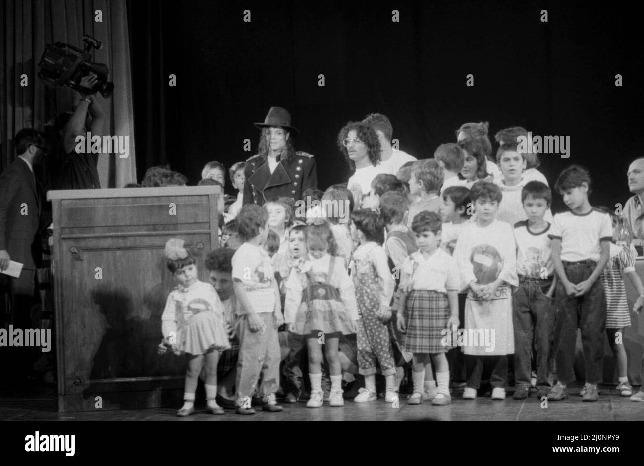 Bucharest, Romania, 1990. American artist Michael Jackson with a group of children from a local orphanage. Stock Photo