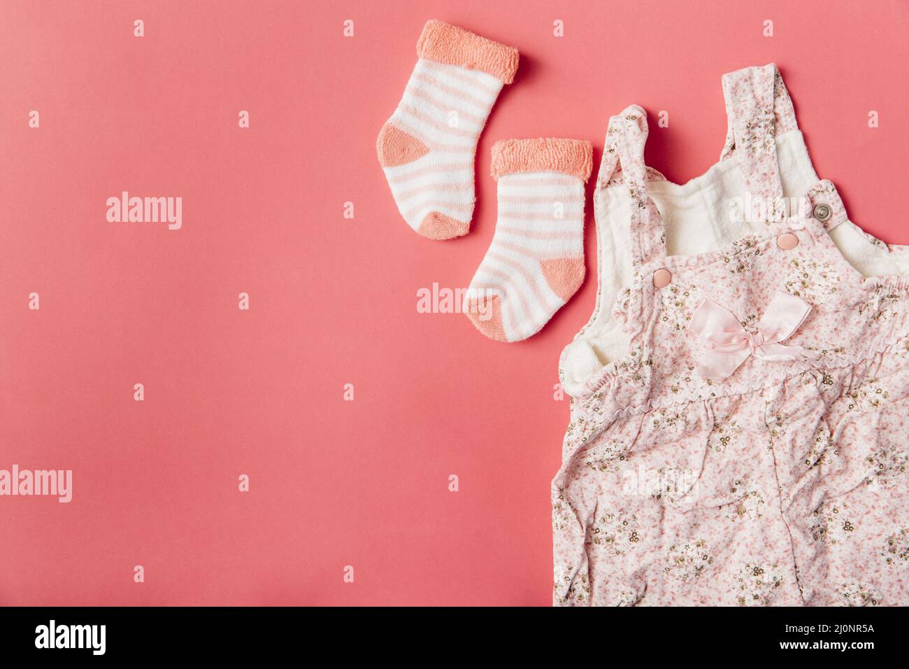 Pair sock baby dress bright colored background . High quality and resolution beautiful photo concept Stock Photo