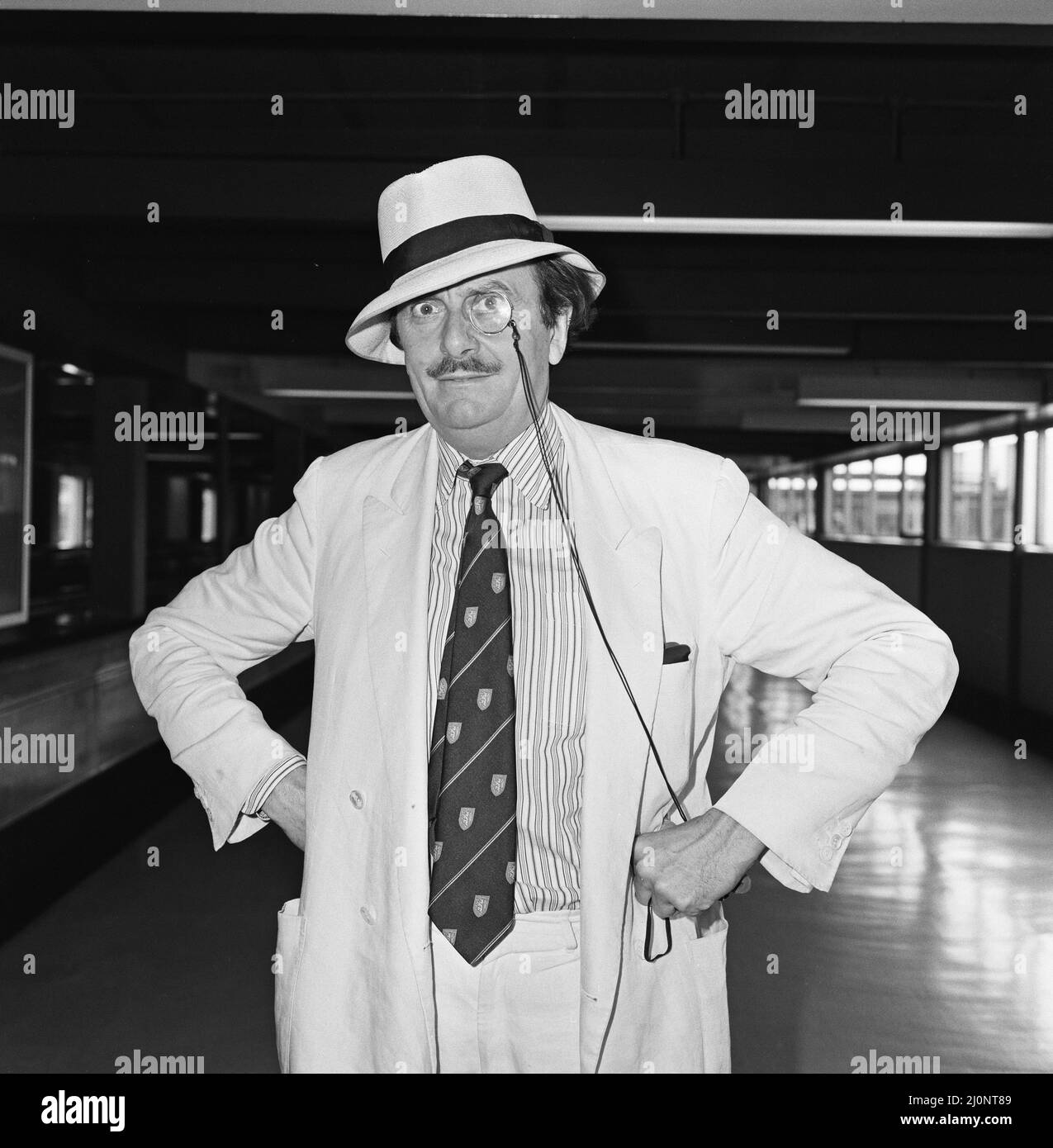 Barry Humphries leaving Heathrow Airport for New York. 10th August 1983