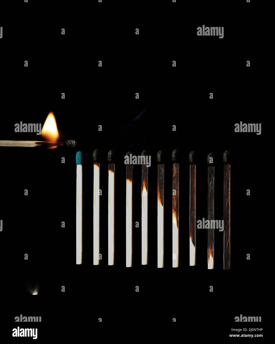 Match stick burning. Match stick in black background. Different stages of match sticks burning. Match stick.  Burnt matchsticks in black background . Stock Photo