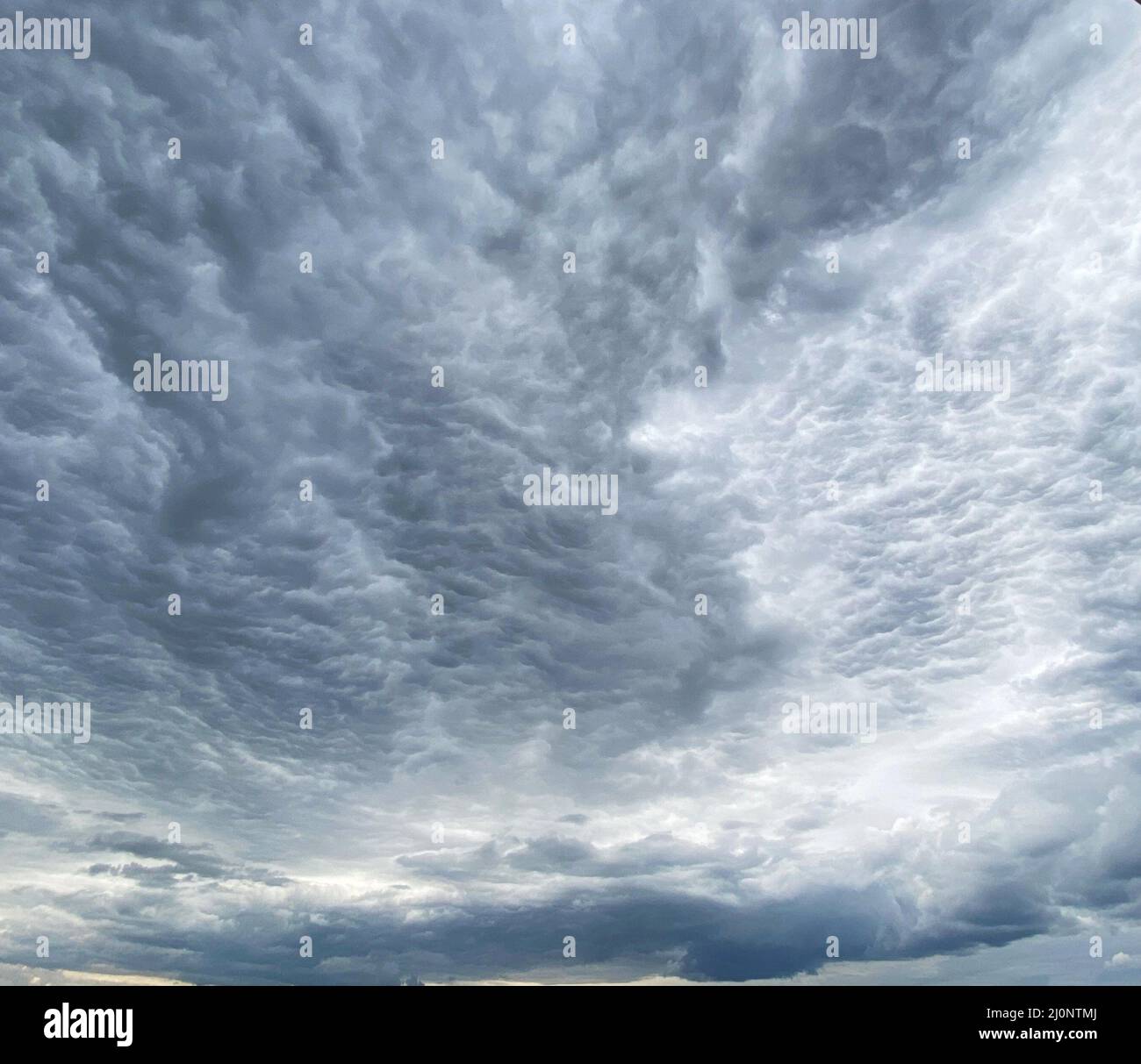 Dark blue cloudy sky with low clouds Stock Photo - Alamy