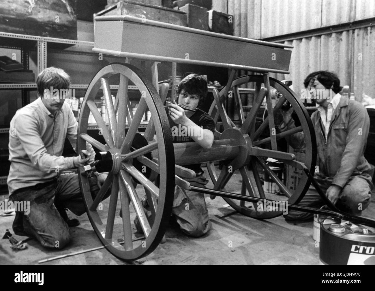 Stockton Preston Hall Museum, 15th July 1983. A trio of job creation workers have launched a Cleveland museums big push to get its collections of historic hand carts on the street. The three men on the Manpower Services Commission scheme at Stockton Preston Hall Museum have set the wheels in motion by starting renovation work on a 60 year old industrial fire cart donatedby a private collector. Pictured working on it are l-r Ivor Jenkinson, Nigel Alexander and Brian Hope. And when they have finished with that, they will move onto the other carts in the collection at Preston Hall Museum, Yarm Ro Stock Photo