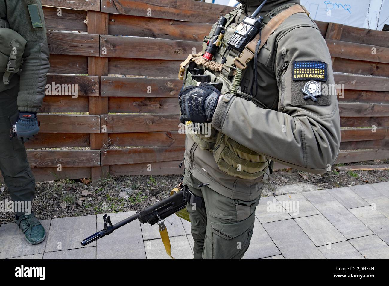 18 March 2022 Odessa, Ukraine Dima, a young man (with orange vest