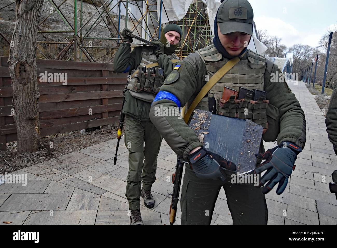 18 March 2022 Odessa, Ukraine Dima, a young man (with orange vest) makes as  a volunteer bullet proof vest and vests that can hold AK magazine for the  army. He has made