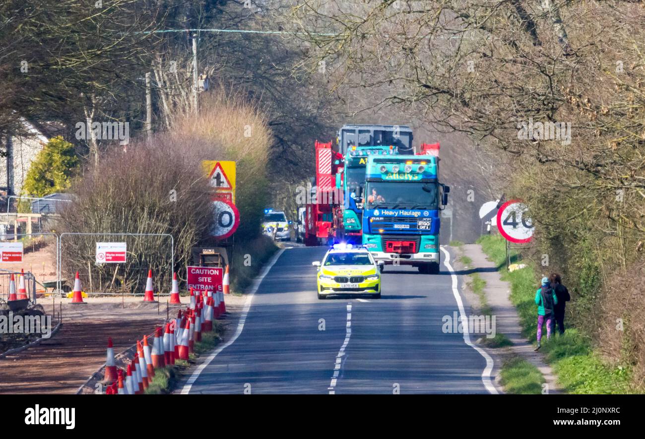 Polegate, East Sussex, UK. 20th Mar, 2022. Significant traffic delays caused across Sussex as an abnormal load makes its journey from Shoreham to the National Grid site at Ninfield. The 70 metre load faced problems during its journey which was expected to conclude on Saturday following mechanical issues with the transporter causing the trip to extend into Sunday morning Credit: Newspics UK South/Alamy Live News Stock Photo