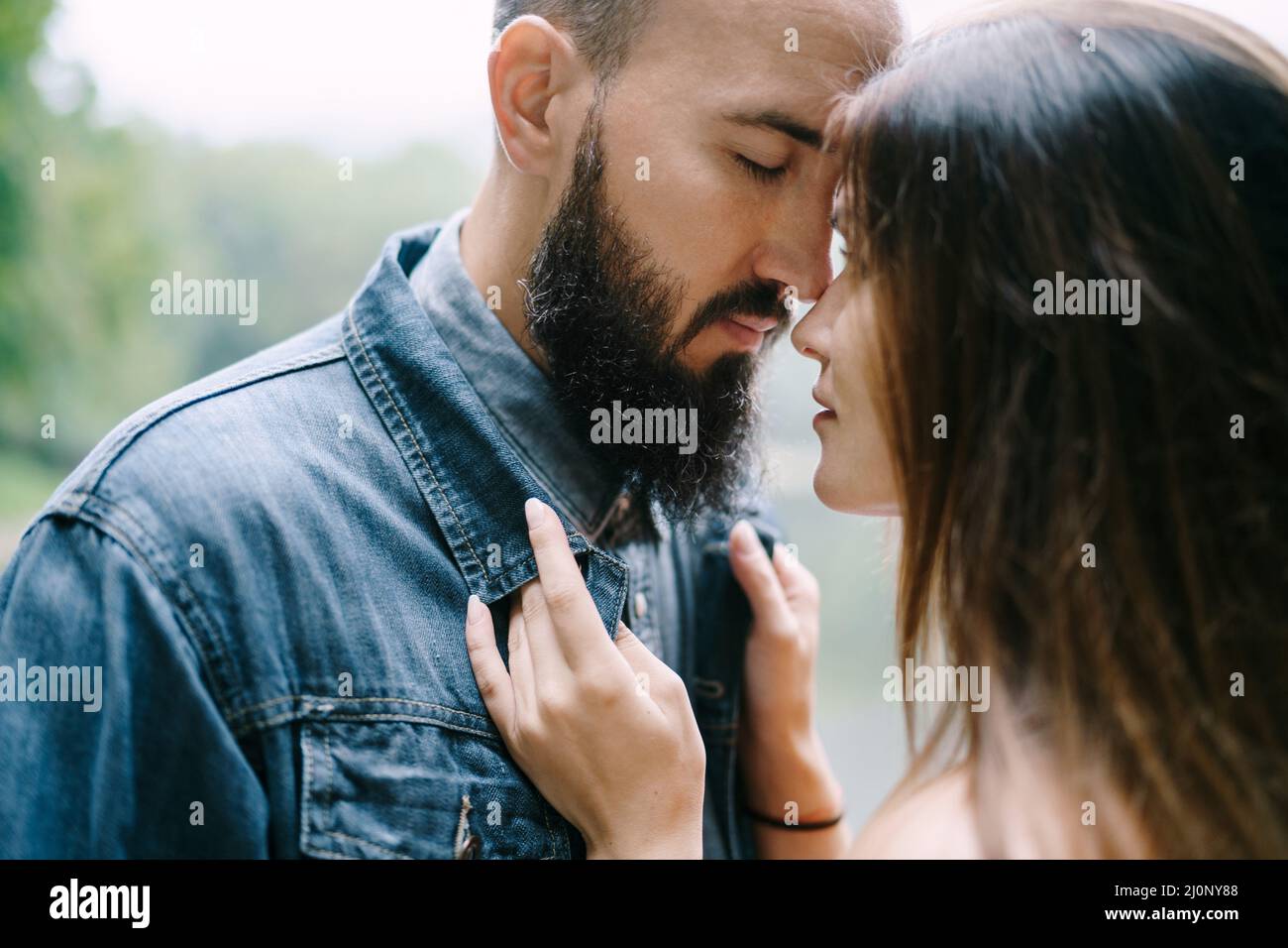 Man leaned his forehead against the woman. Close-up Stock Photo