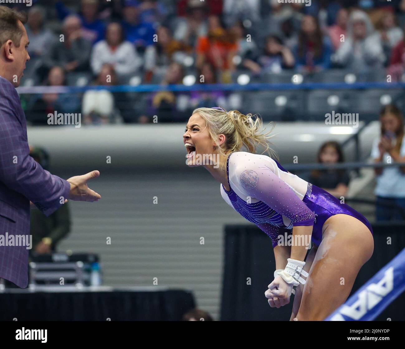 March 19, 2022 LSU's Oli Dunne celebrates after her bar dismount at