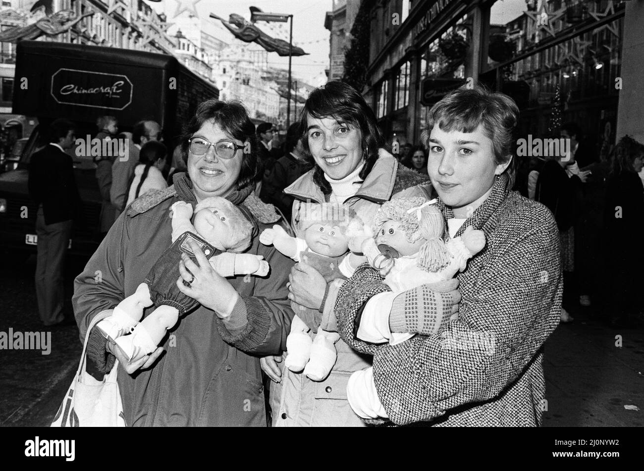 Cabbage Patch Dolls at Hamleys, top London toy store. Hundreds of people clamoured for the dolls when the store opened at 9.00 this morning, Saturday. The first three ladies in the store were Chris Daughtrey and her sister Lorraine and Pam Southgate, all from Worthing. 3rd December 1983. Stock Photo