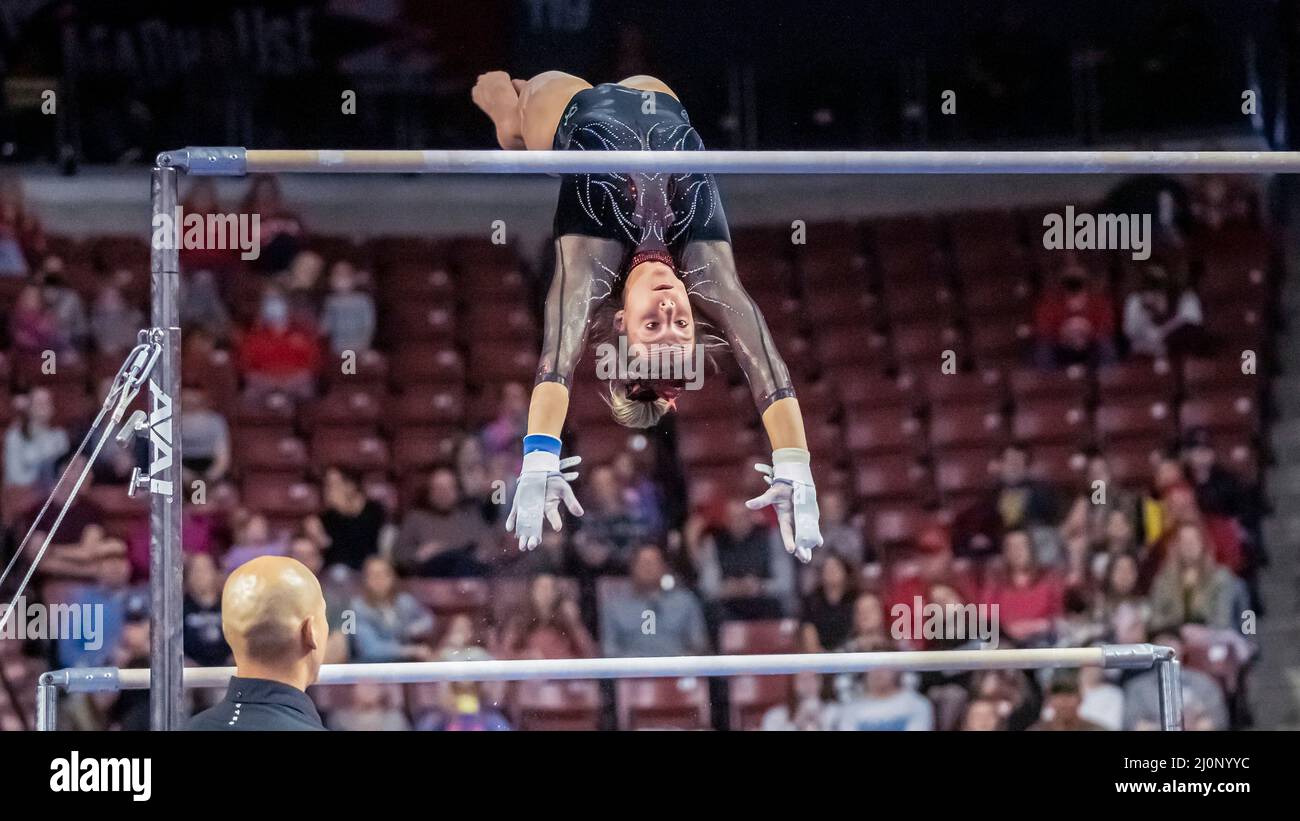 The University of Utah's Grace McCallum, a 2020 Olympic team silver medalist, swings from the low bar to the high and wins the uneven parallel bars with perfect 10.0 at the Pac12 Women's Gymnastics Championship at Maverik Center in Salt Lake City, Utah on March 19, 2022 (photo by Jeff Wong/Sipa USA). Stock Photo